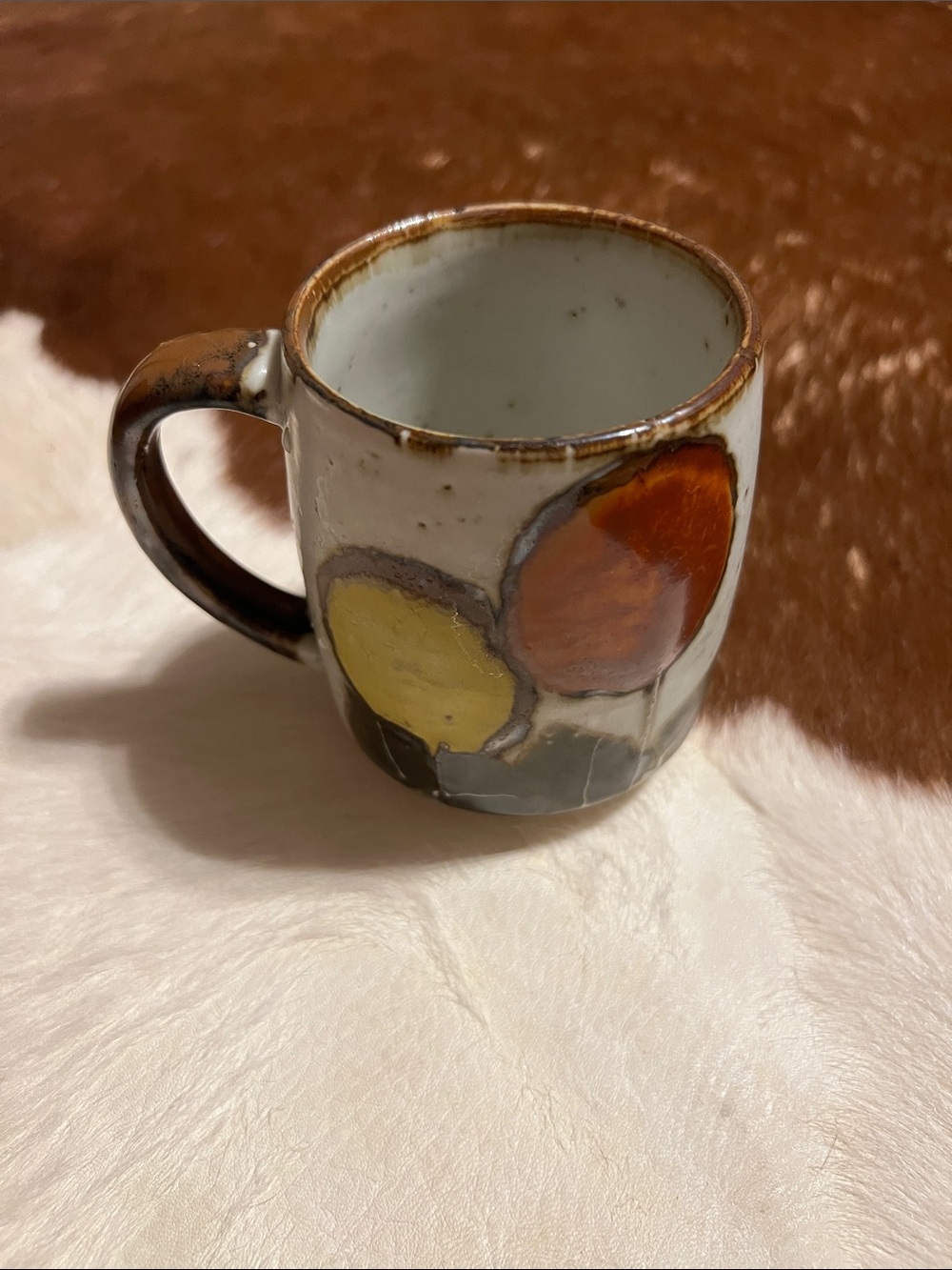 Handcrafted Stoneware Art Mug in Warm Brown, Orange, and Yellow